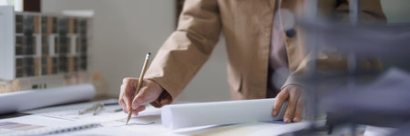 Female architect design architecture interior building project to drawing construction on blueprint.の写真素材