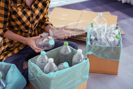 Women sorting and compressed plastic bottle to reuse and recycling for conservation environment.の写真素材
