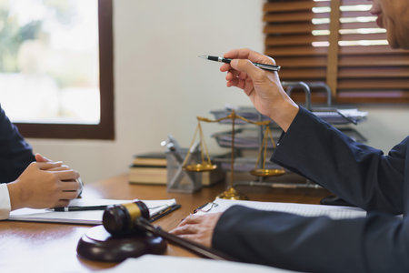 Law and justice concept, Senior lawyer explaining and provide legal advice to young female lawyer.の写真素材