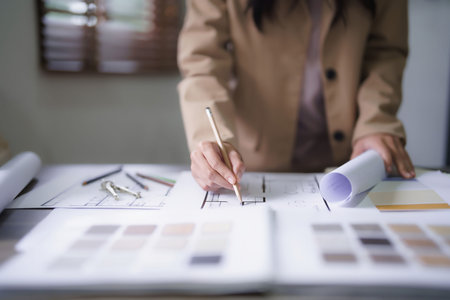 Female architect design architecture interior building project to drawing construction on blueprint.