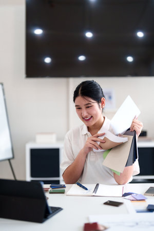Young architect presenting interior design ideas through laptop during online meeting in creative officeの写真素材