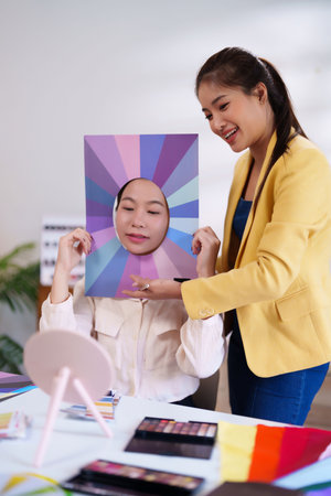 Discover your perfect seasonal palette with our personal color analysis guide. Young Asian women learn to choose the most flattering shades for clothes and makeup.の写真素材