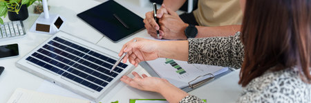 ESG focused executives review sustainability data embracing innovative renewable energy concepts for...