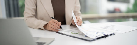 Experienced real estate professional diligently evaluates financial statements and market trends. Focus data driven decisions maximizing sales potential.の写真素材