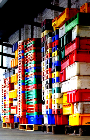 Colorful stacked plastic containers fisheriesの写真素材