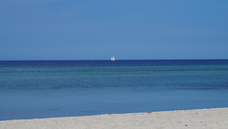 Blue sky and white beach at the Baltic sea at Timmendorf beachの写真素材