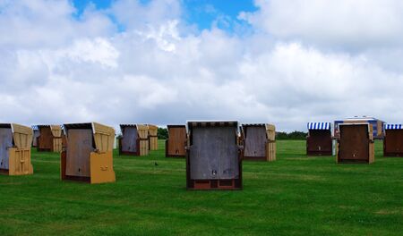 Beach chairs at Buesum on the North Sea in bad weatherの写真素材