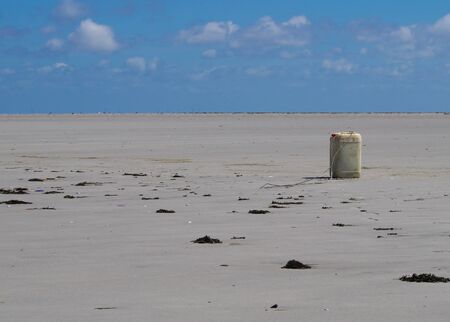 empty canister in the wadden of the North Seaの写真素材