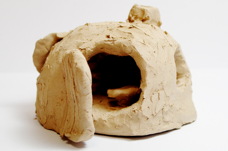 Sculpture of a cave made of clay from art therapyの写真素材