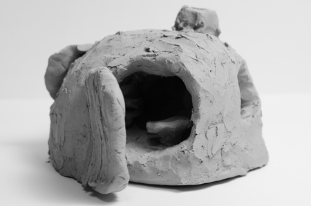 Sculpture of a cave made of clay from art therapyの写真素材