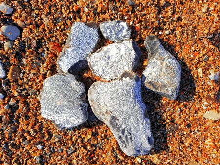 Edged flints in the sand on the Baltic Seaの写真素材