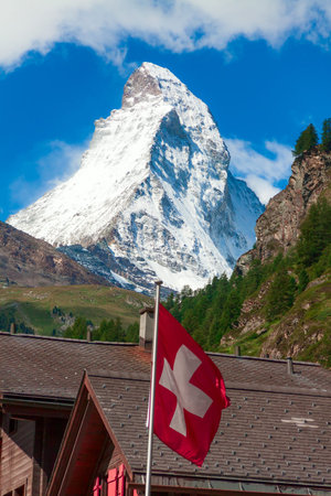 Views of the Matterhorn with Swiss flagの写真素材