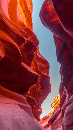 Fissures in the sandstone at the exit area You can see the sky and the light creates colorful patterns on the sandstone at The Lower Antelope Canyon in Arizona,の写真素材