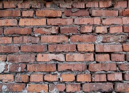 Rough and weathered old dirty brick wallの写真素材