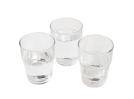 Three glasses of water - one nearly empty, one half full, one almost full の写真素材