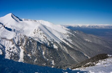Panorama of winter mountains. Alpine ski resort Bansko, Bulgariaの写真素材