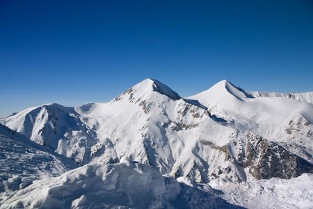 Panorama of winter mountains. Alpine ski resort Bansko, Bulgariaの写真素材