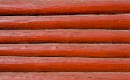 Background of old red  wooden boards (beams)の写真素材