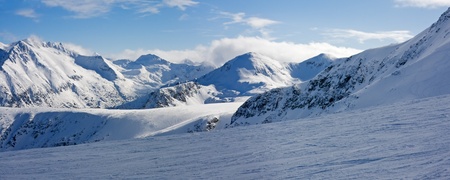 Ski slope and panorama of winter mountains. Alpine ski resort Bansko, Bulgariaの写真素材