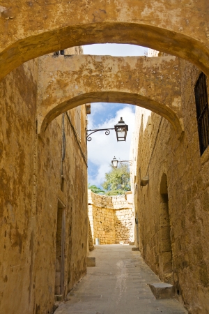 Narrow medieval street in the citadel of Gozo, Malta の写真素材