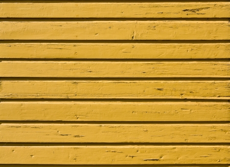 Old yellow painted wooden plank background. Close upの写真素材