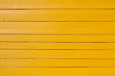 Old yellow painted wooden plank background. Close upの写真素材