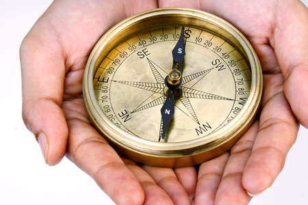 Old Navigational compass in the hands 
