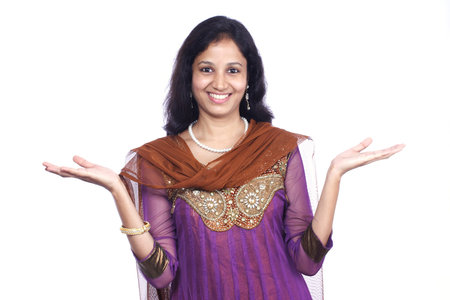 Excited young woman against white backgroundの写真素材