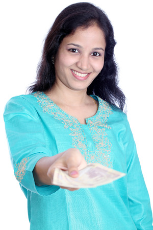Young Indian woman holding Indian currency notes の写真素材
