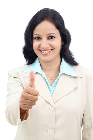 Young businesswoman showing thumbs up isolated against white background の写真素材