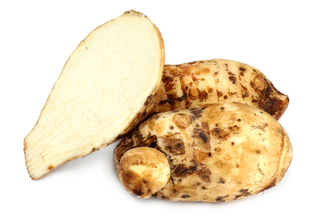 Edible taros over white backgroundの写真素材