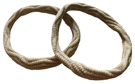 Image of a cream colored hair band with a woven patternの写真素材