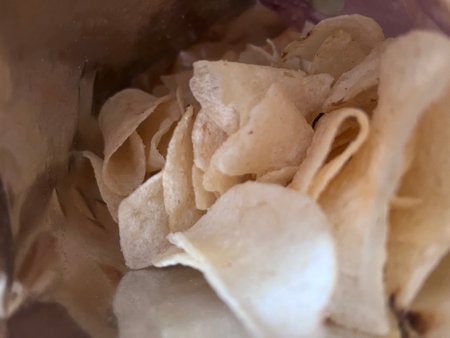 Photo of potato chips from inside the bag. Potato chips, crispy, snack.の写真素材