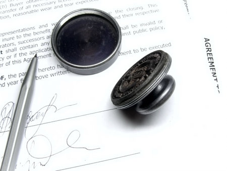 pen and stamp on the agreement  