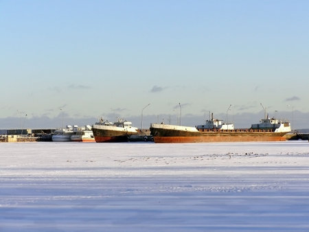 Many ships in ice of the frozen winter seaの写真素材