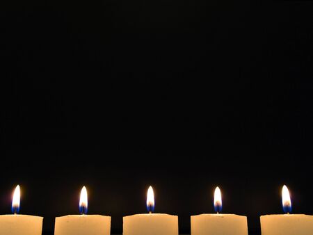 Photo of five candles in nightの写真素材