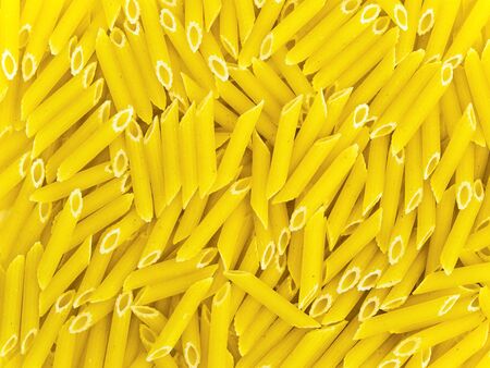 photo of the yellow macaroni backgroundの写真素材