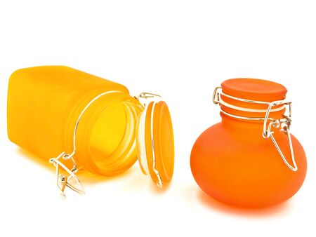 two orange decorative jars over the white backgroundの写真素材