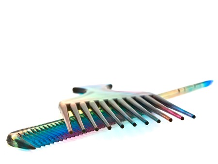 two multicolored combs at the white backgroundの写真素材