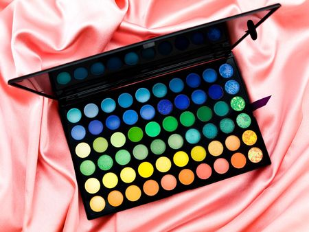 multicolored eye shadows at the pink fabric backgroundの写真素材