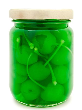 jar with green cherry against the white backgroundの写真素材