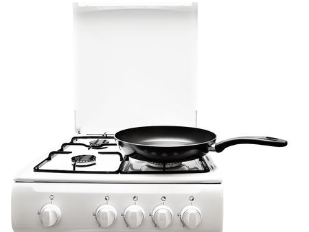 frying pan at the white gas stove over the white backgroundの写真素材