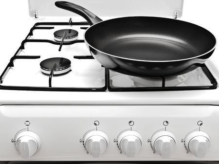 frying pan on the white gas cookerの写真素材