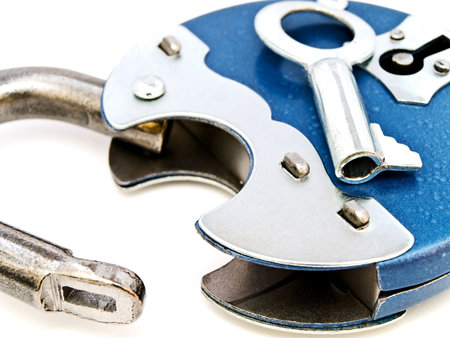blue metal padlock with key against the white background