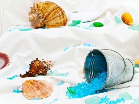 Photo of marine decor with sea shells, bucket and decorative stones at white の写真素材