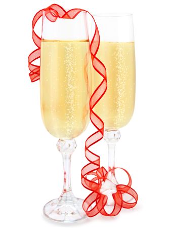 Two elegant champagne glasses with red ribbon against white background の写真素材