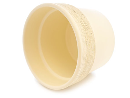 empty beige flowerpot over the black backgroundの写真素材