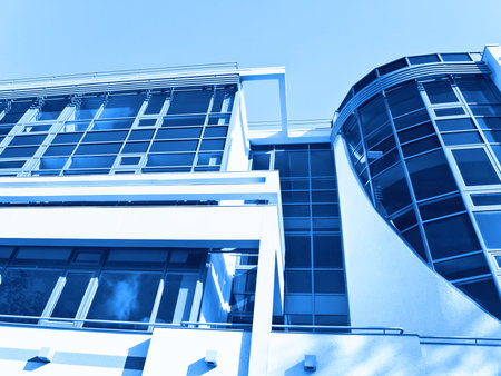 Part of modern office building over blue sky