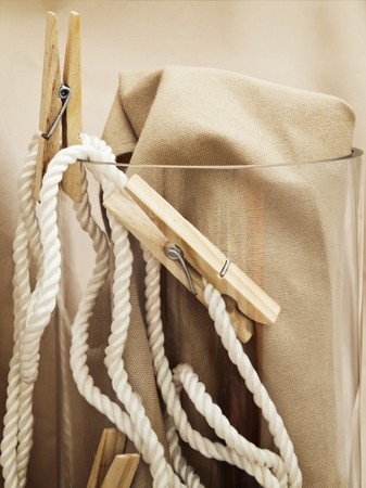 handmade composition with vintage pins and rope over beigeの写真素材