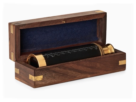 antique brass telescope in wooden box over whiteの写真素材